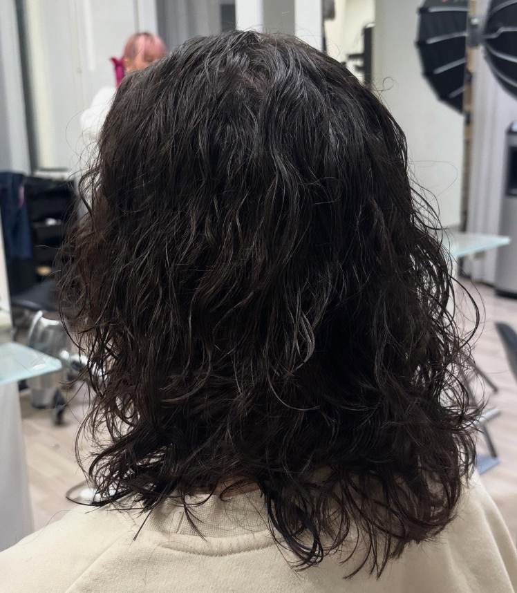 Effortless, lived-in wavy texture from a cold wave perm.