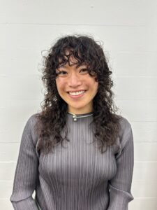 Bouncy, defined curls from a modern spiral perm.