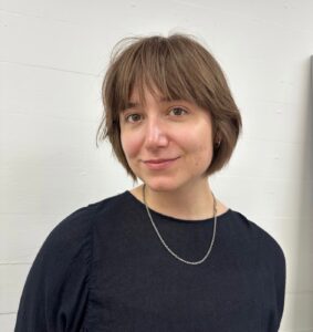 A back view of a classic bob haircut. The hair is cut to a uniform, blunt length that sits right at the jawline, creating a sleek and symmetrical look.