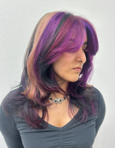 A front profile of a "berry-toned" calico style. This look features a vibrant mix of magenta pink, platinum blonde, and deep black sections, giving the traditional calico pattern a vivid, colorful twist.