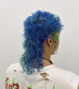 Neon blue with neon green peekaboo, curly, back profile